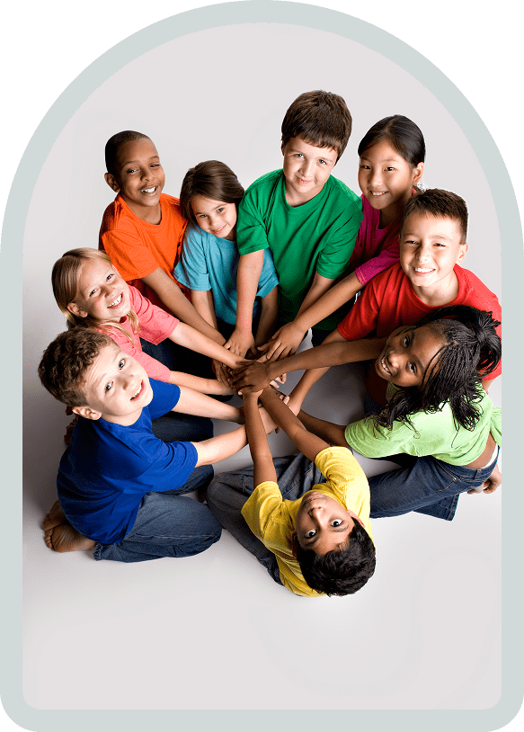 Diverse children joining hands in circle
